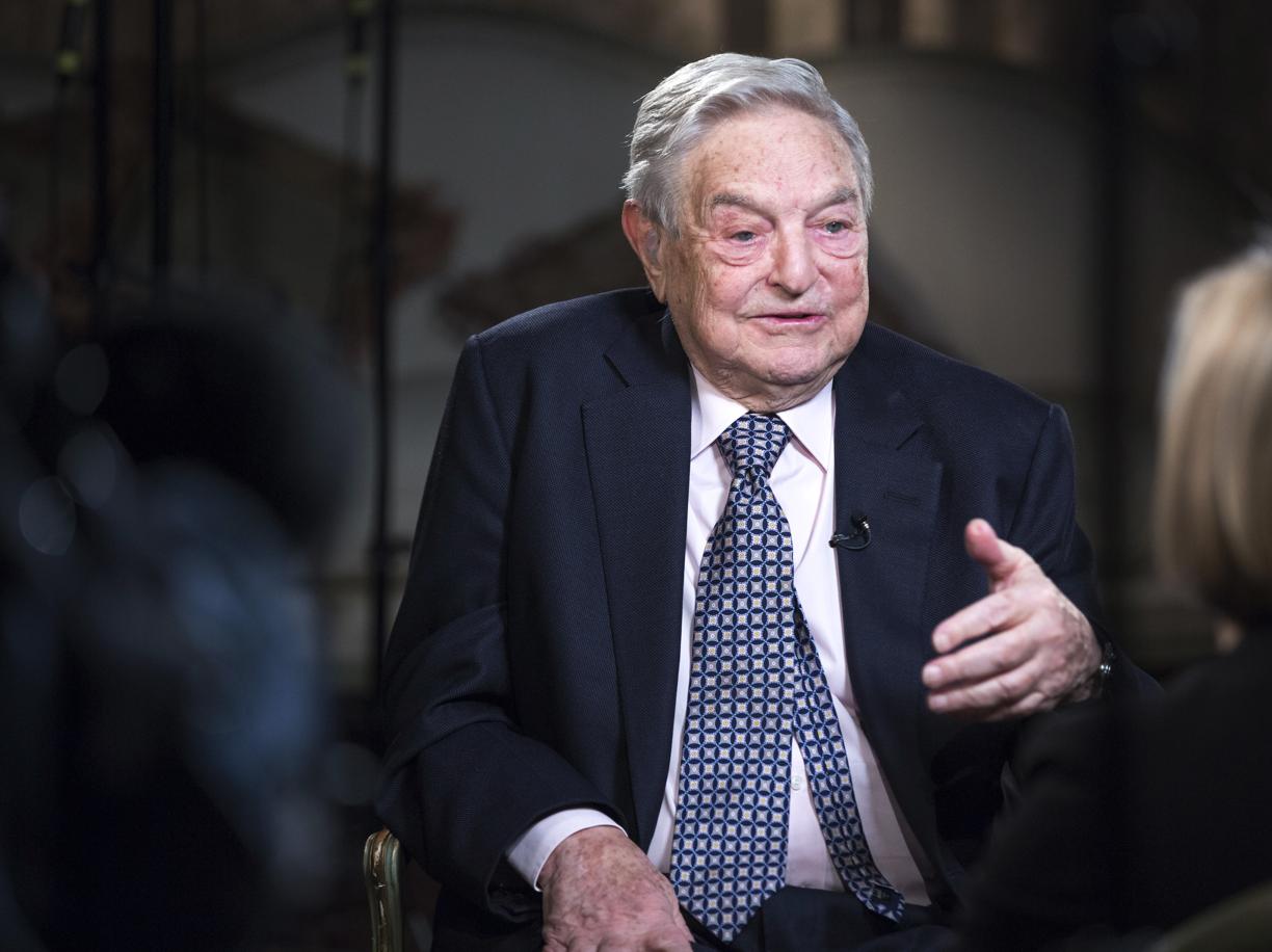 George Soros, billionaire and founder of Soros Fund Management LLC, speaks with Bloomberg Television anchor Francine Lacqua, right, during an interview recorded at his home in London, U.K., on Monday, March 24, 2015. The chances of Greece leaving the euro area are now 50-50 and the country could go down the drain, billionaire investor Soros said. Photographer: Jason Alden/Bloomberg via Getty Images